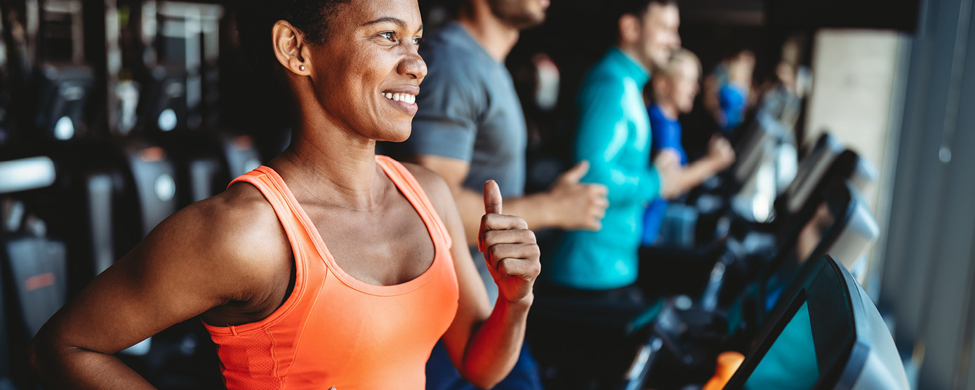 line of folks running on treadmills