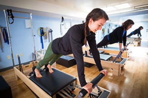 Female staff engaged in pilates. 