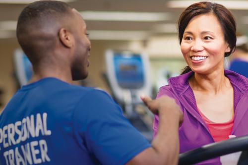 Personal Trainer helping YMCA member