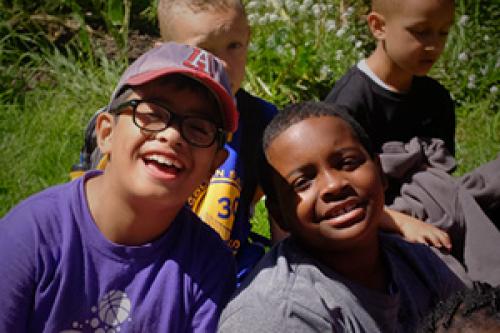 Two kids smiling at camp