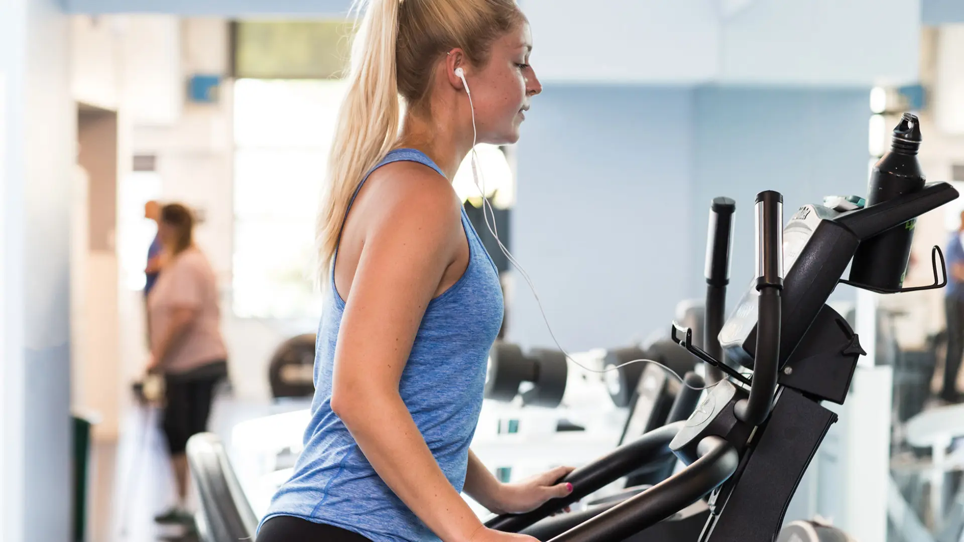 Young adult female on cardio machine at the Albany YMCA
