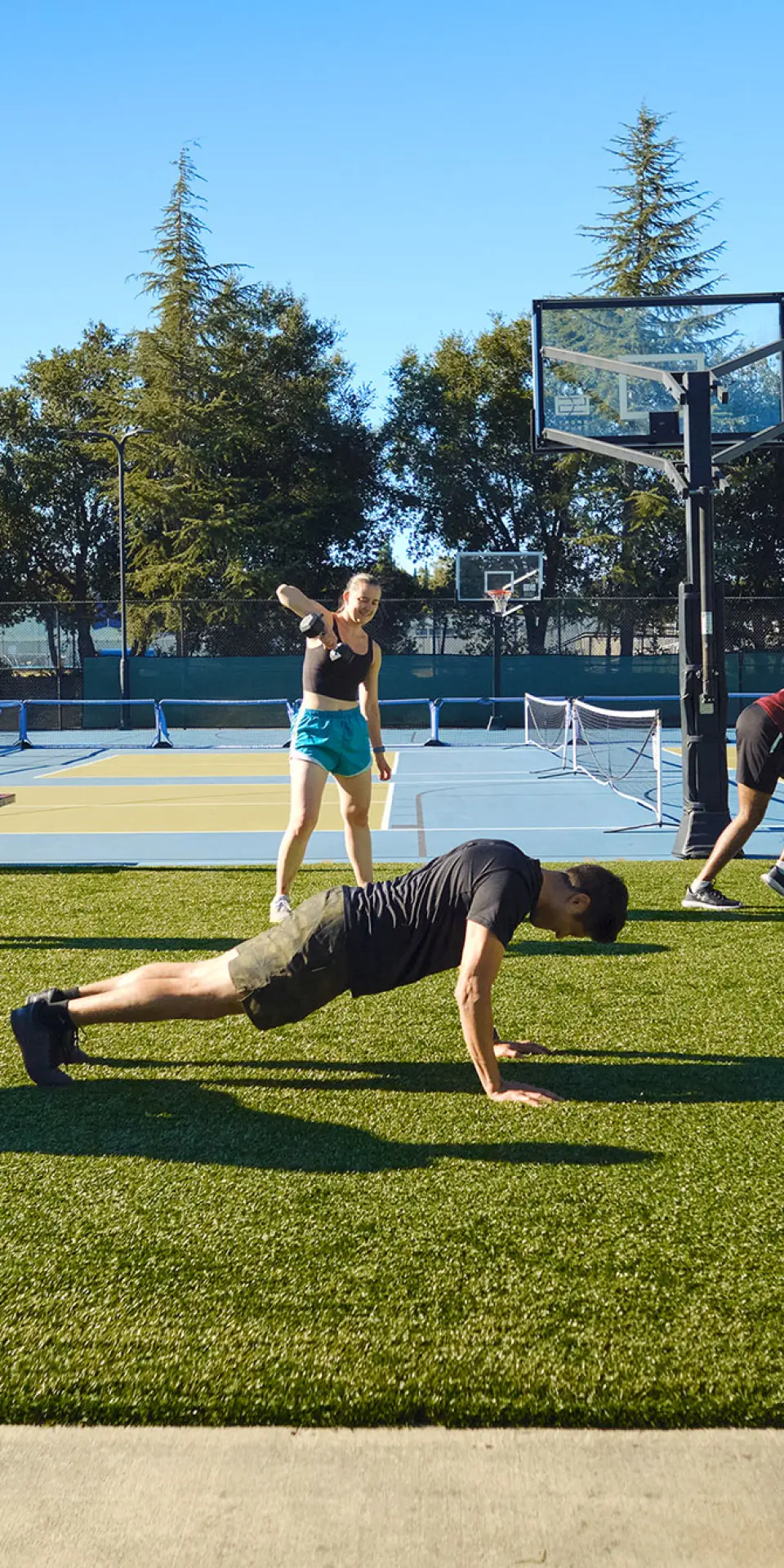 Small group training on the outdoor turf area of. the Pleasant Hill YMCA