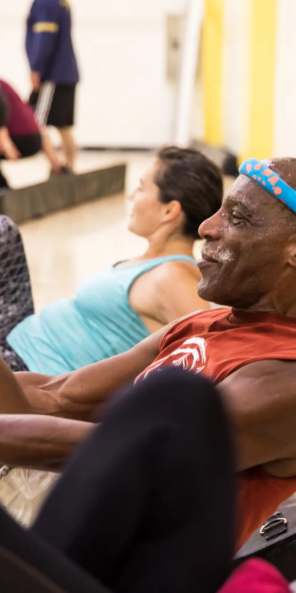 Adult senior male enjoying a group exercise cardio class at the Richmond Parkway YMCA