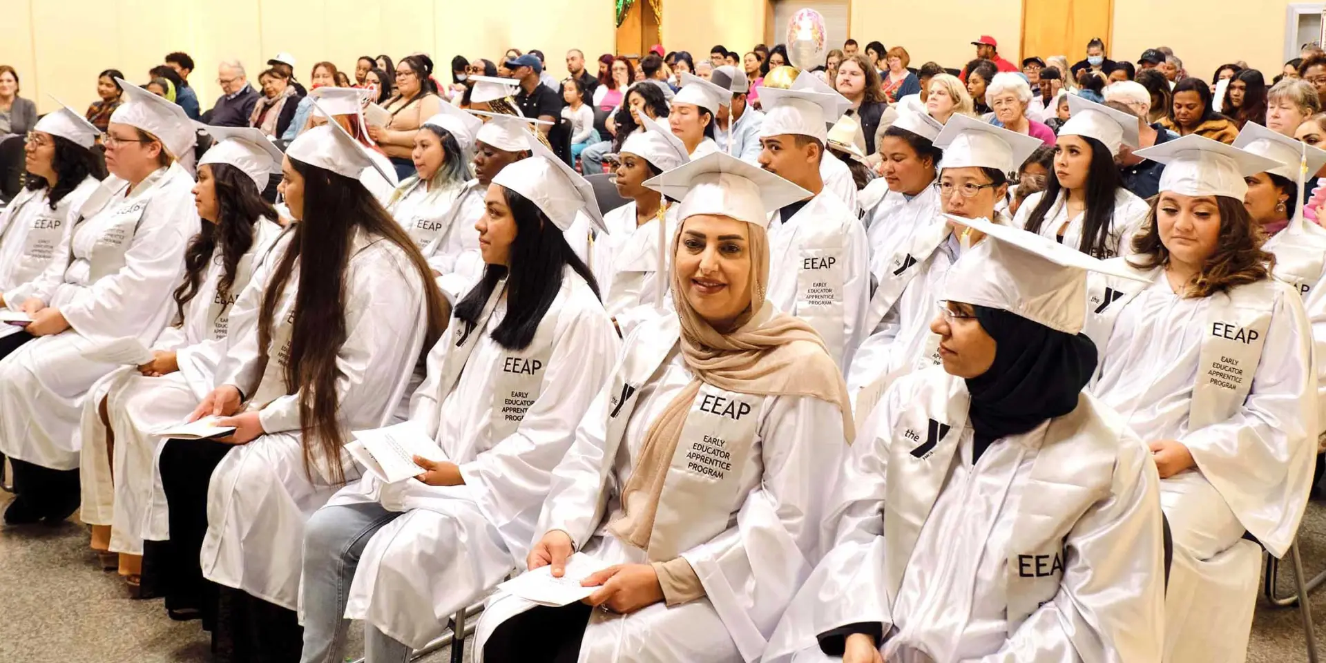 YMCA Early Educator Apprentice Program graduation in auditorium in 2024