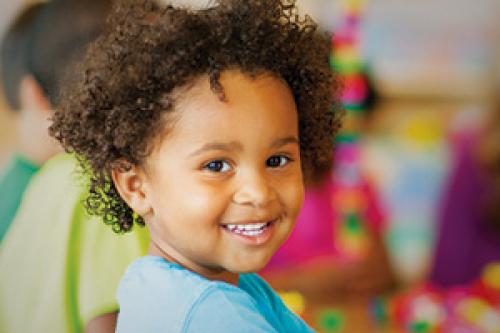 Kid smiling while at child care