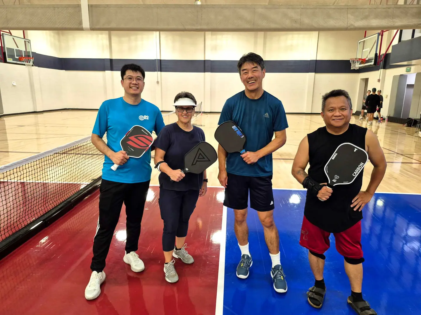 group of four Pickleball players at the Richmond Parkway YMCA