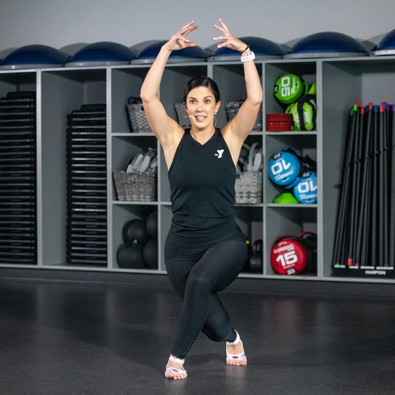 Y trainer demonstrating a barre exercise