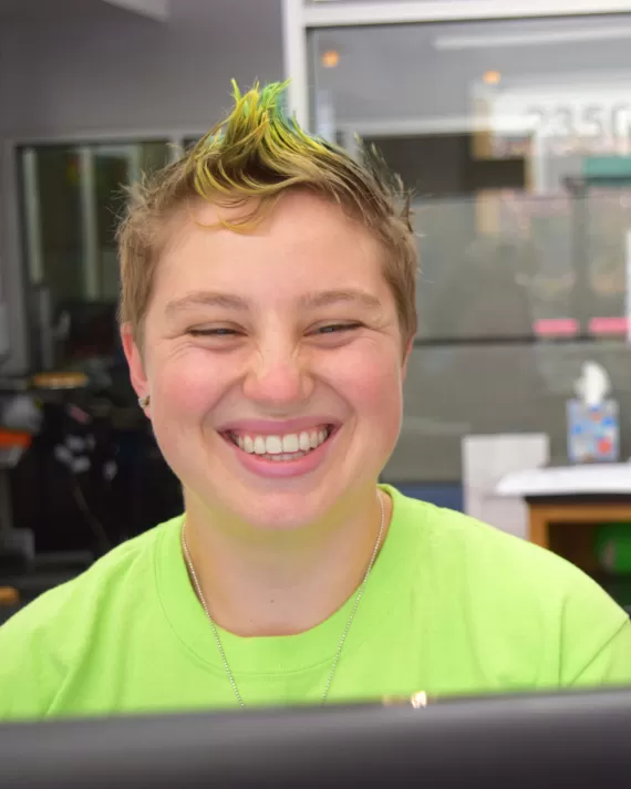 Davi smiling at the front desk