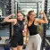 teen female students smiling in front of weight rack at the Berkeley YMCA
