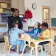 Early Learning Center preschool teacher with a group on student at a classroom table