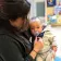Infant being held and soothed by preschool teacher