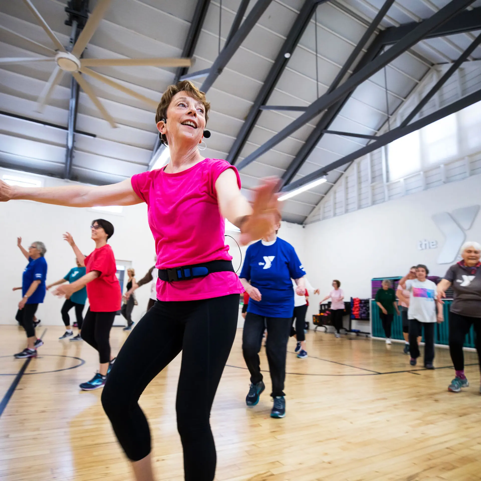 Mary D'elia leading the group exercise cardio class at the Albany YMCA