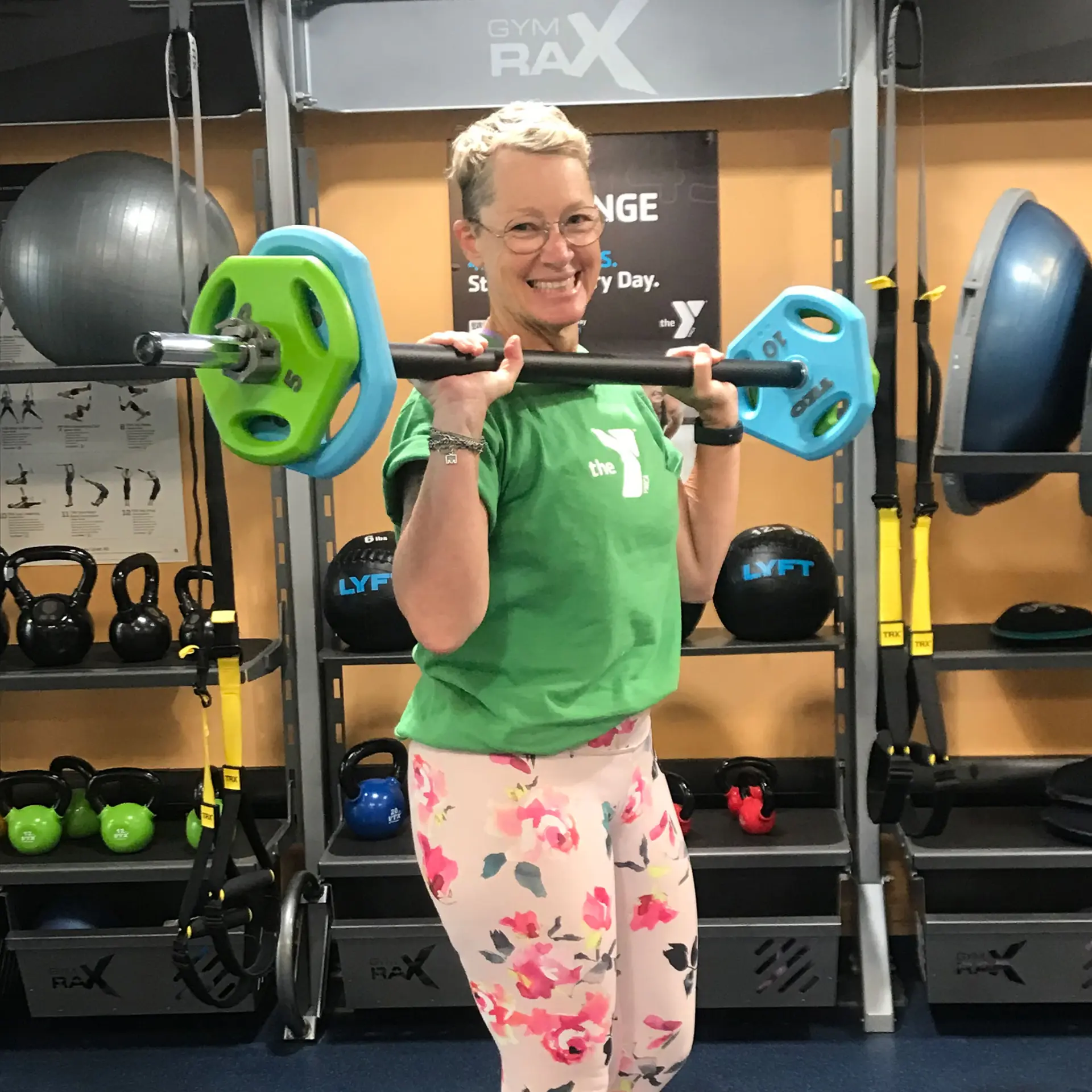Fitness Director Jenny holding barbell weights