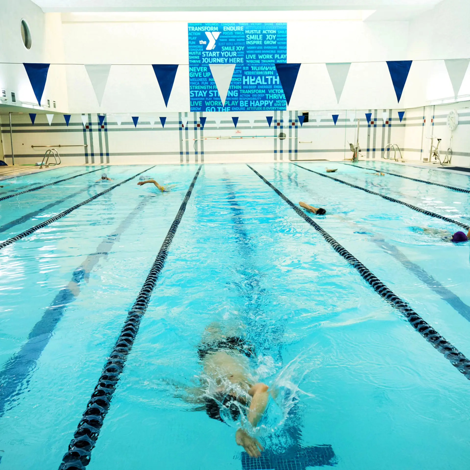 Berkeley YMCA members swimming in lap pool