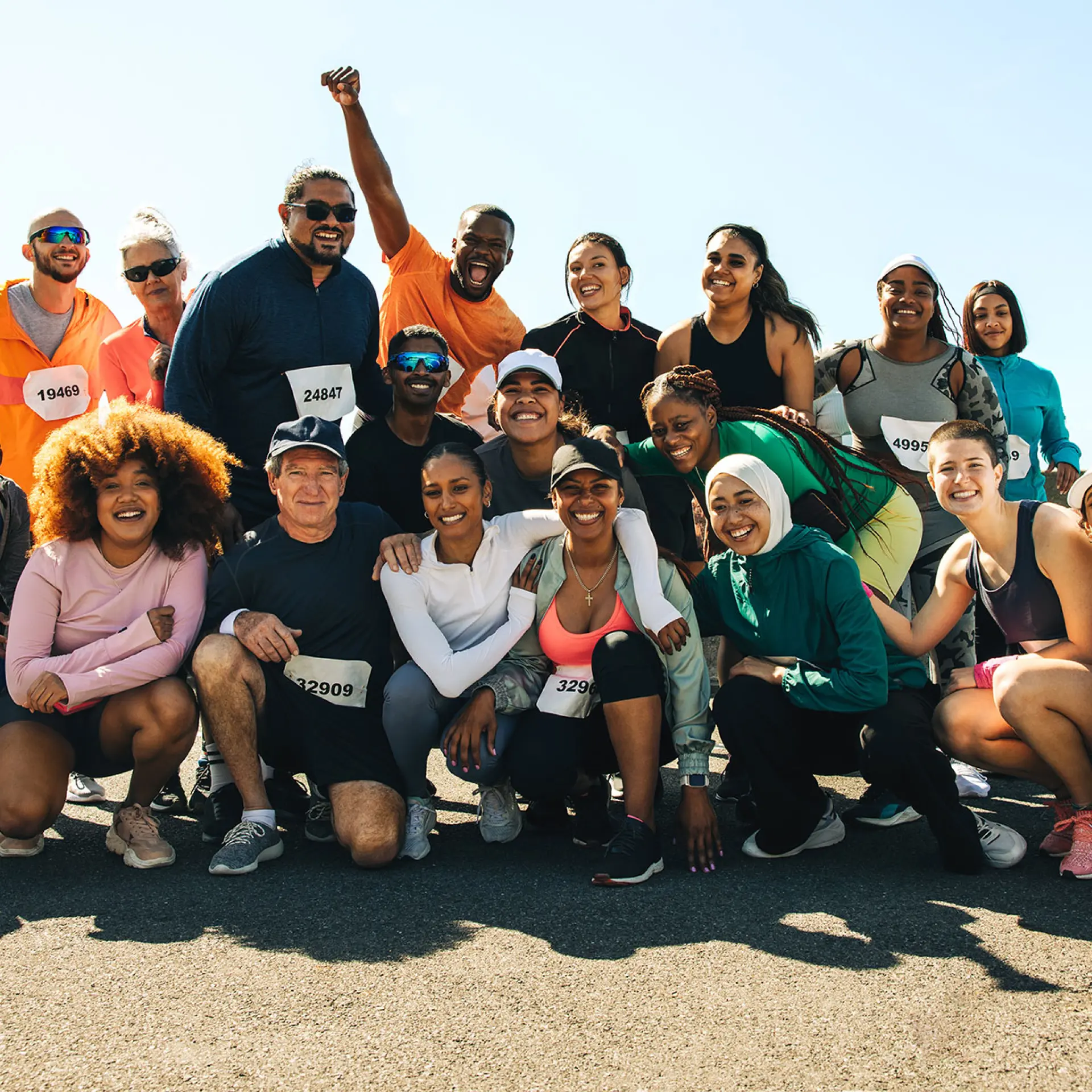 Group of adult members joining in a running event