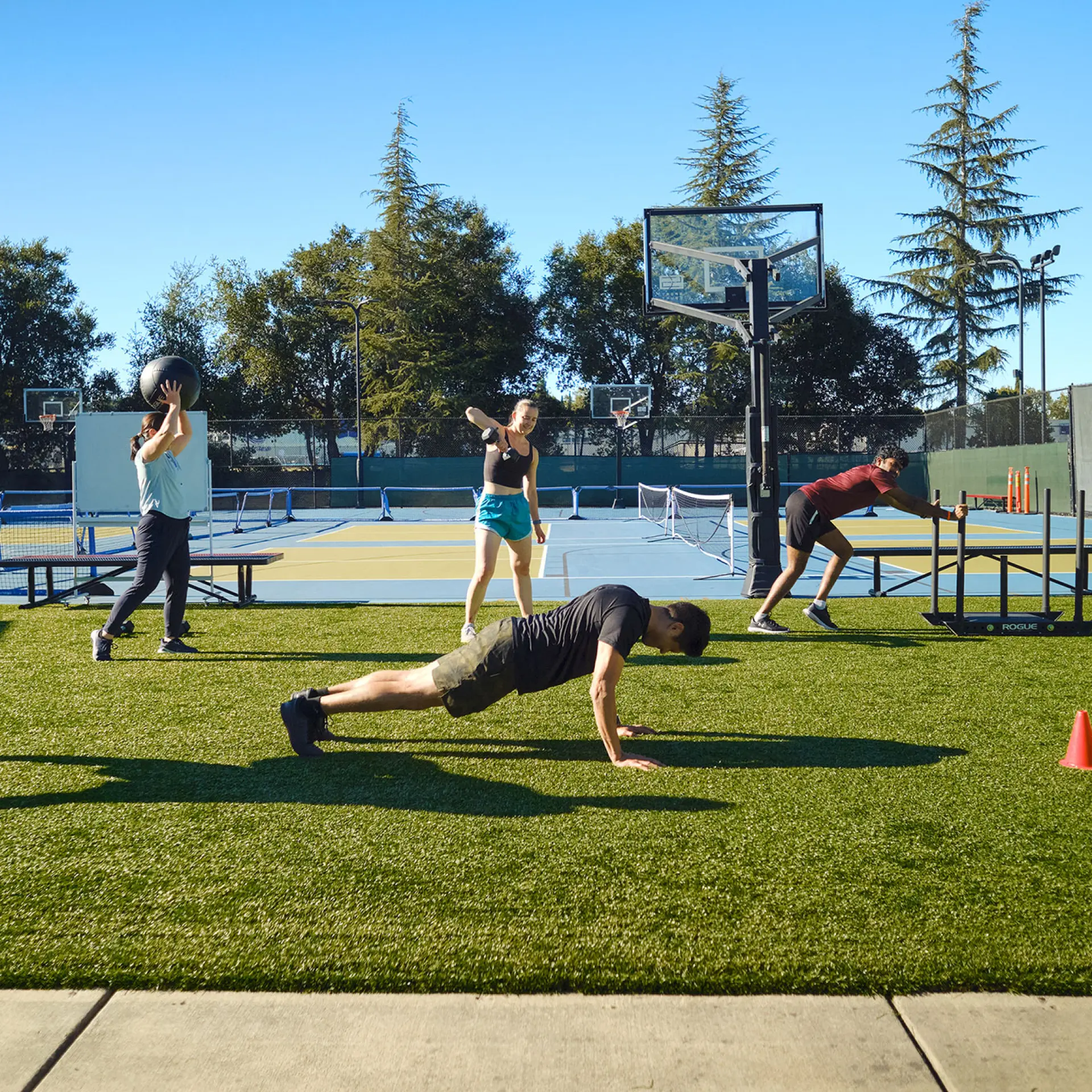 Small group training on the outdoor turf area of. the Pleasant Hill YMCA