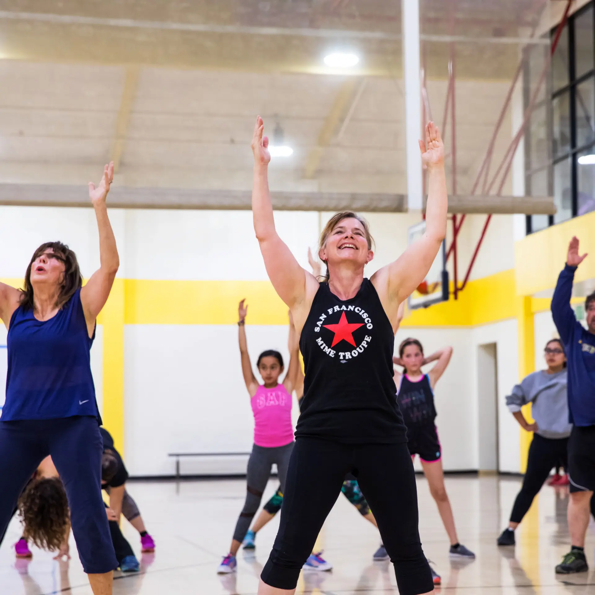 Members participating in a cardio group exercise class at the Richmond Parkway YMCA
