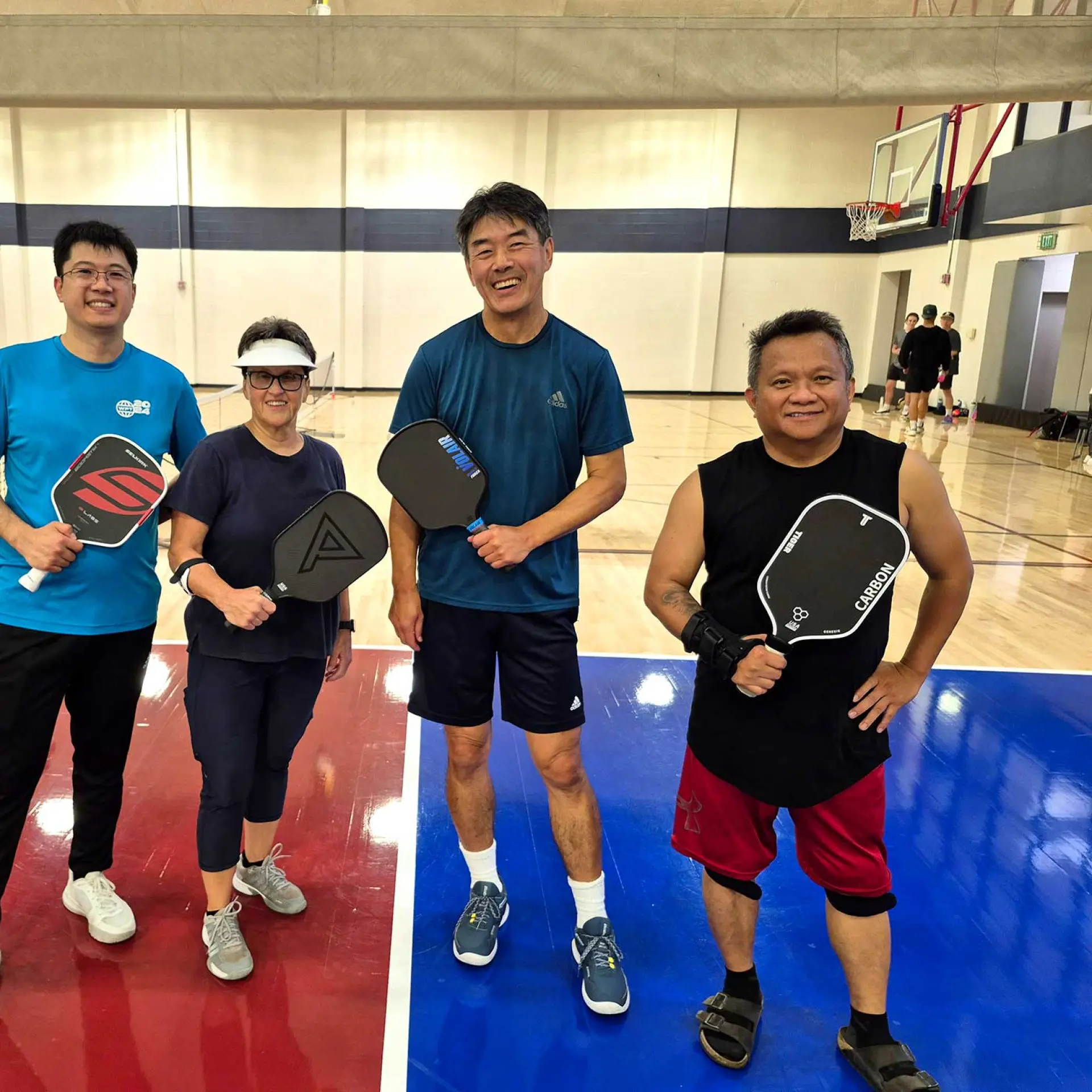 group of four Pickleball players at the Richmond Parkway YMCA